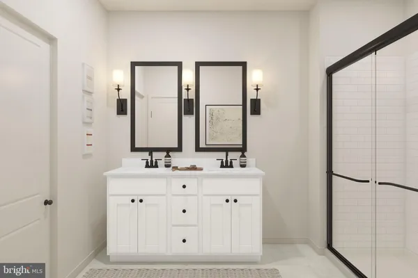 a bathroom with a double vanity sink and mirror