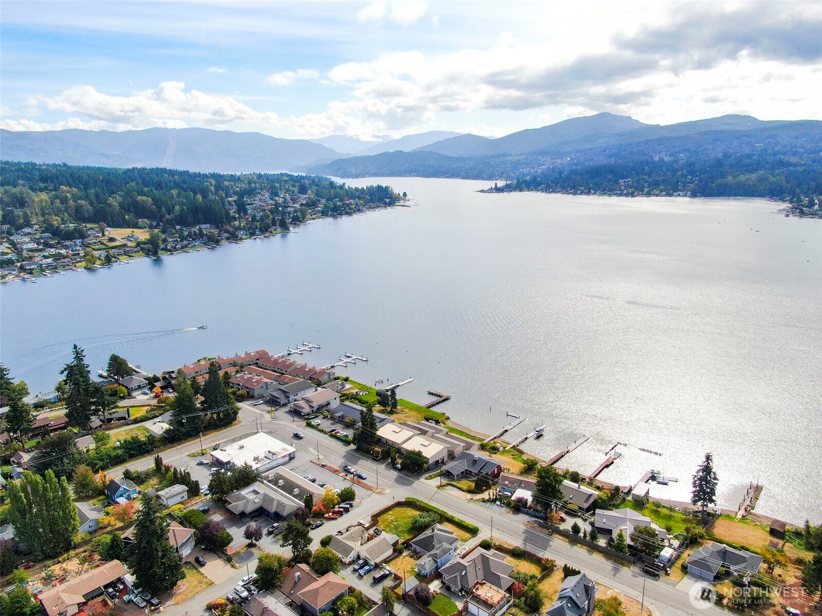 an aerial view of a houses with lake view