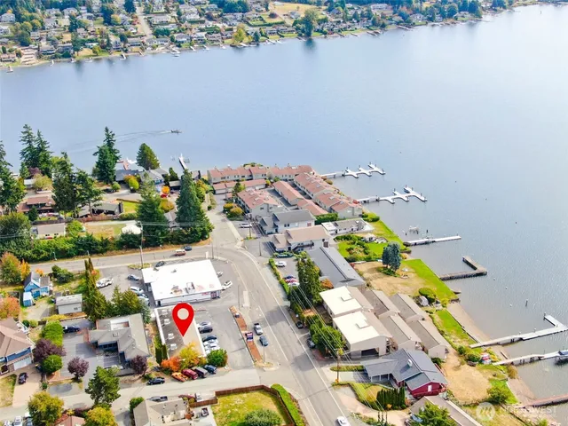 an aerial view of a house a table and a chairs