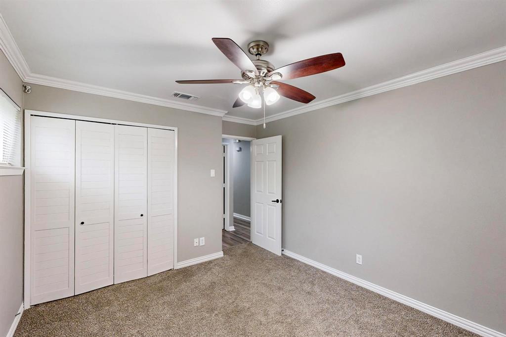 3264 Northaven Road Dallas, TX 75229 - Photo 24 of 35 Unfurnished bedroom featuring a closet, crown molding, carpet, baseboards, and a ceiling fan