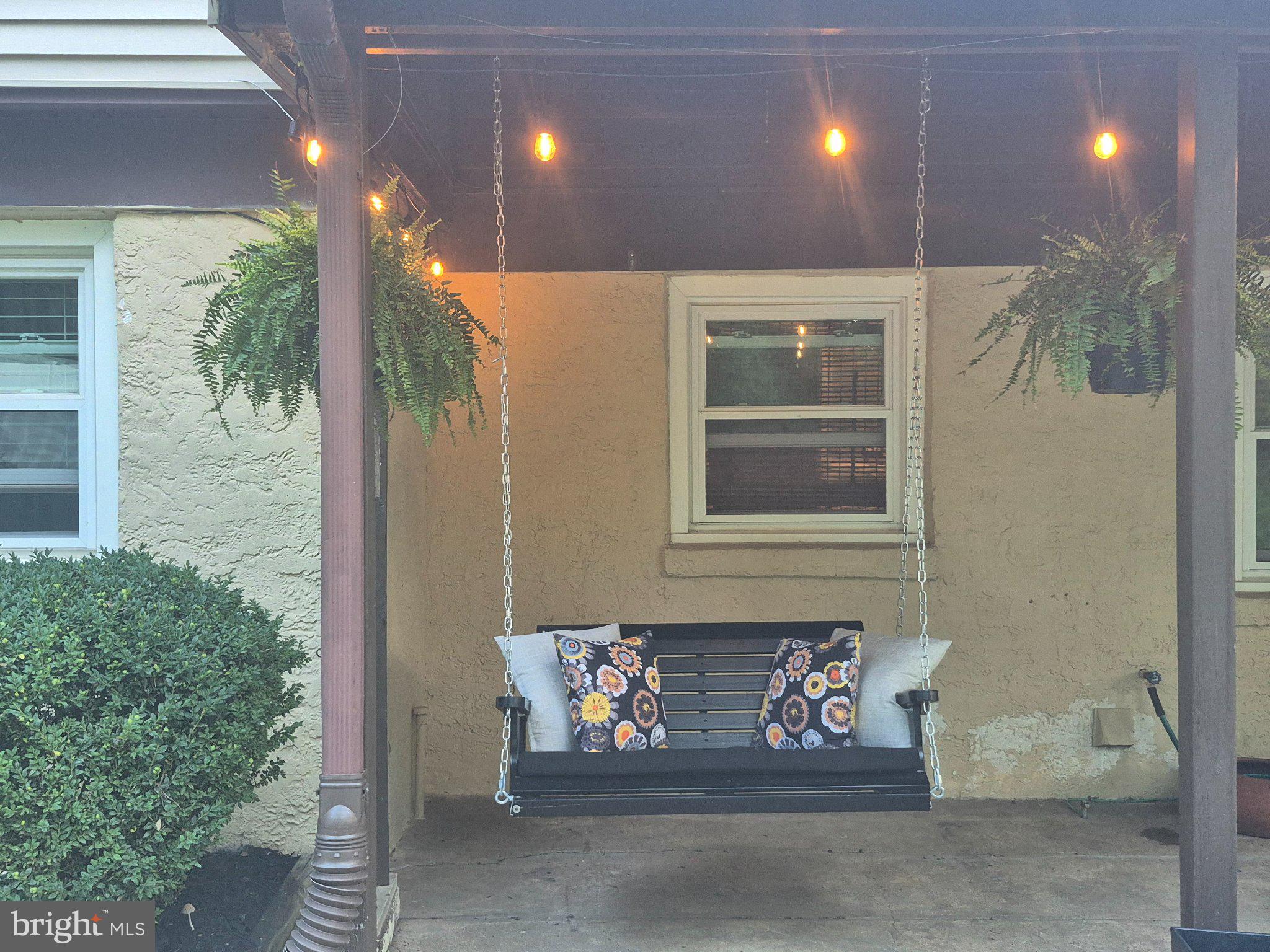 1305 Twining Road Dresher, PA 19025 - Photo 54 of 75 Charming porch swing under twinkling lights.