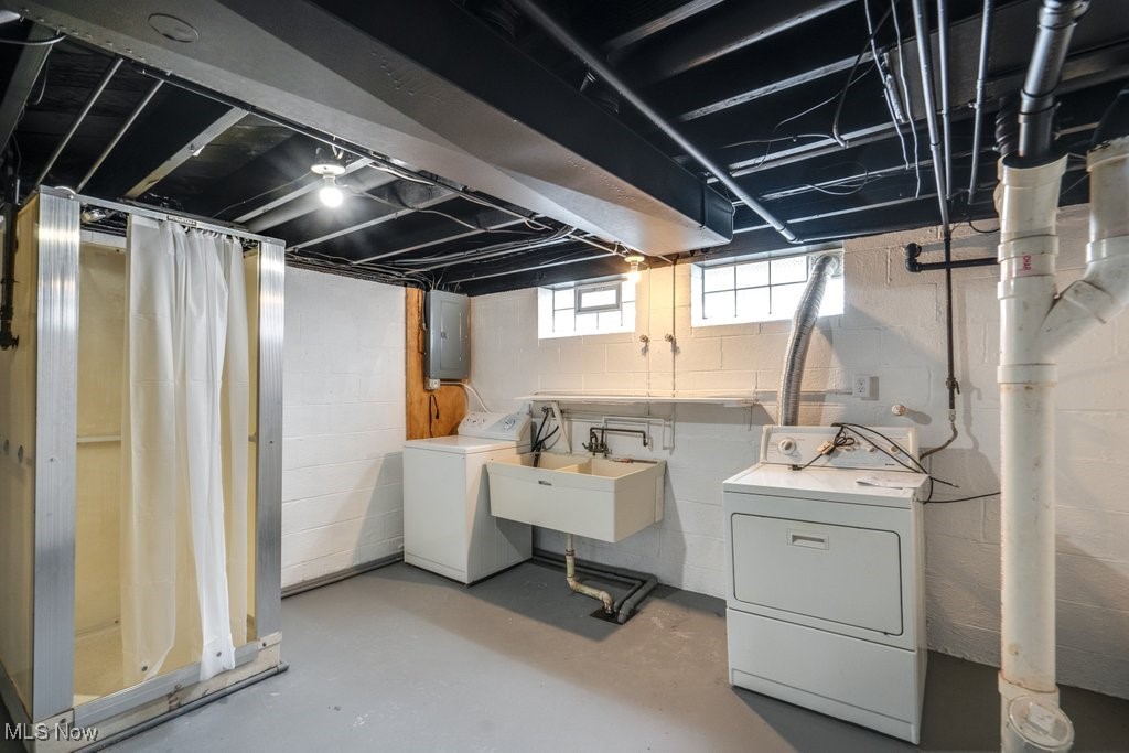 6961 Maplewood Road Parma Heights, OH 44130 - Photo 19 of 22 Basement featuring electric panel, sink, and washer and dryer