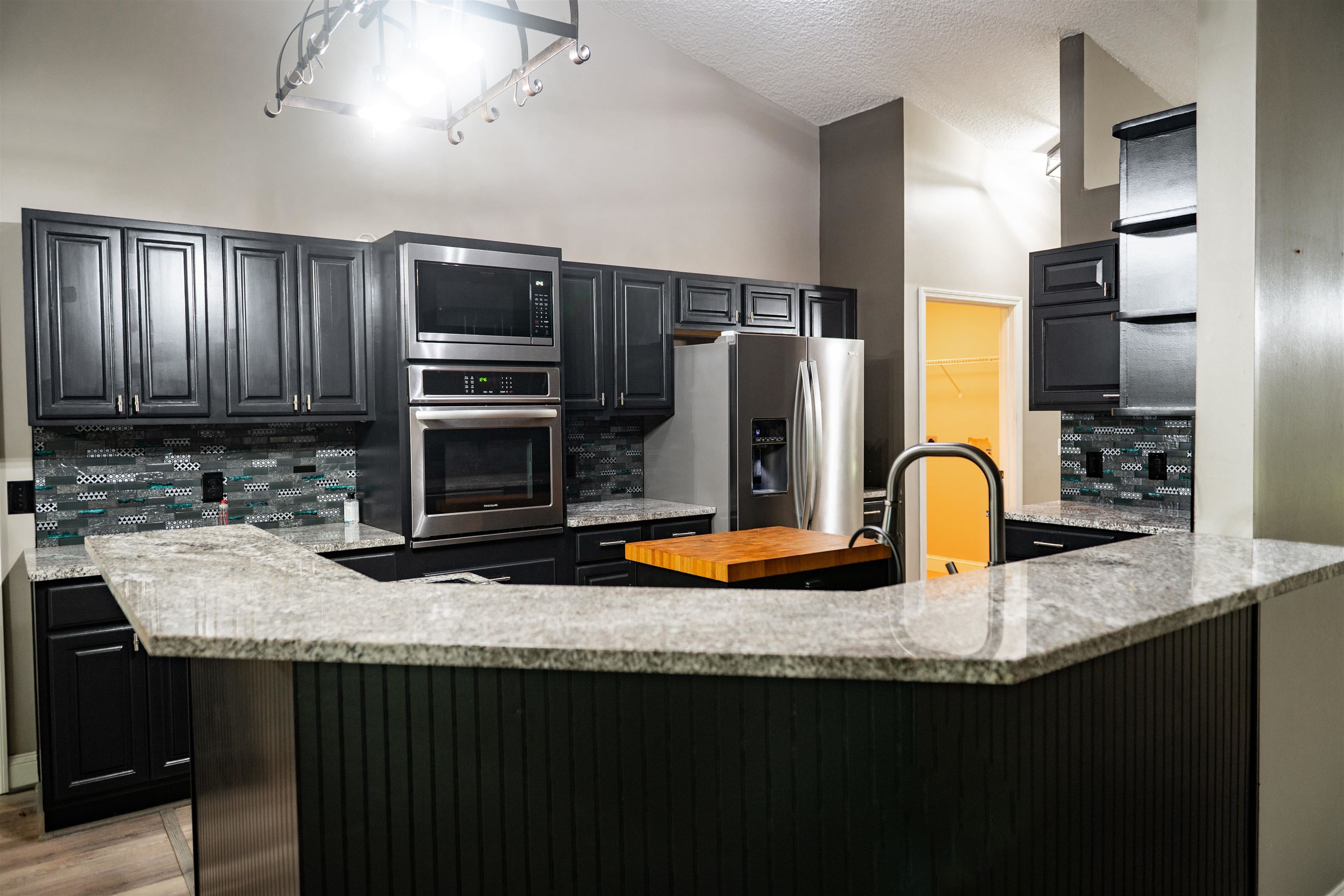 2950 Kings Road St. Augustine, FL 32086 - Photo 20 of 42 a kitchen with stainless steel appliances granite countertop a sink a stove and refrigerator