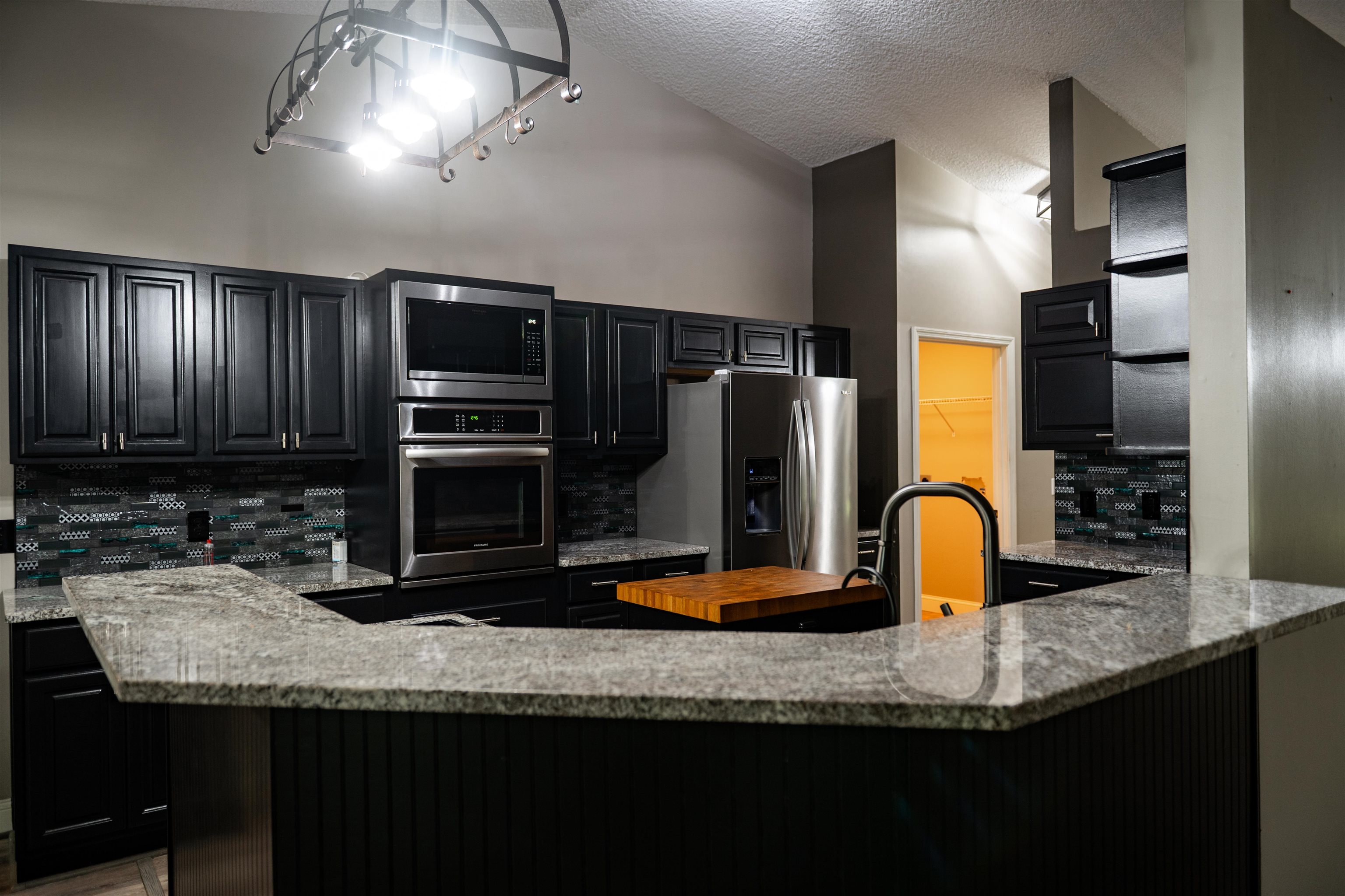 2950 Kings Road St. Augustine, FL 32086 - Photo 21 of 42 a kitchen with stainless steel appliances granite countertop a sink refrigerator and microwave