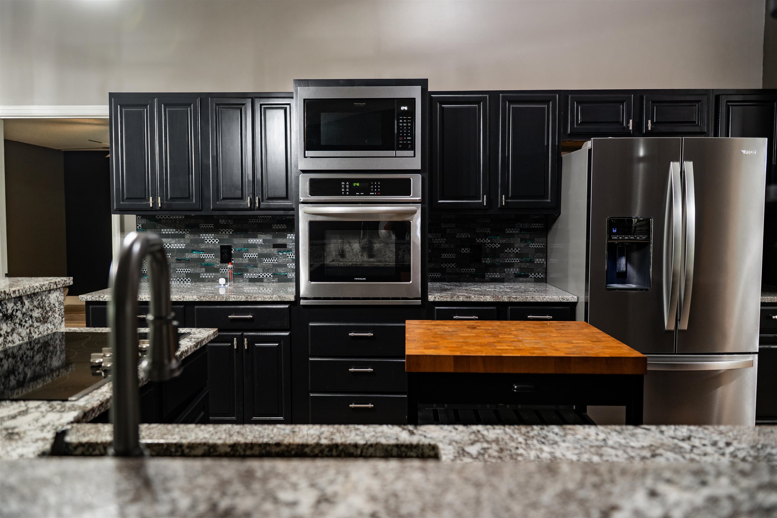 2950 Kings Road St. Augustine, FL 32086 - Photo 22 of 42 a kitchen with stainless steel appliances kitchen island granite countertop a refrigerator stove and oven