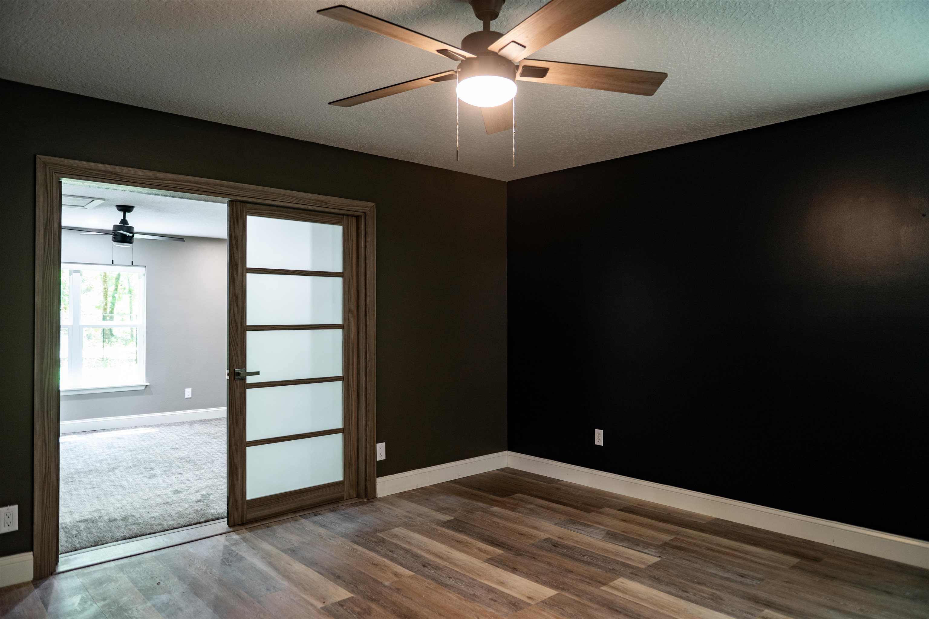 2950 Kings Road St. Augustine, FL 32086 - Photo 23 of 42 wooden floor in an empty room with a window