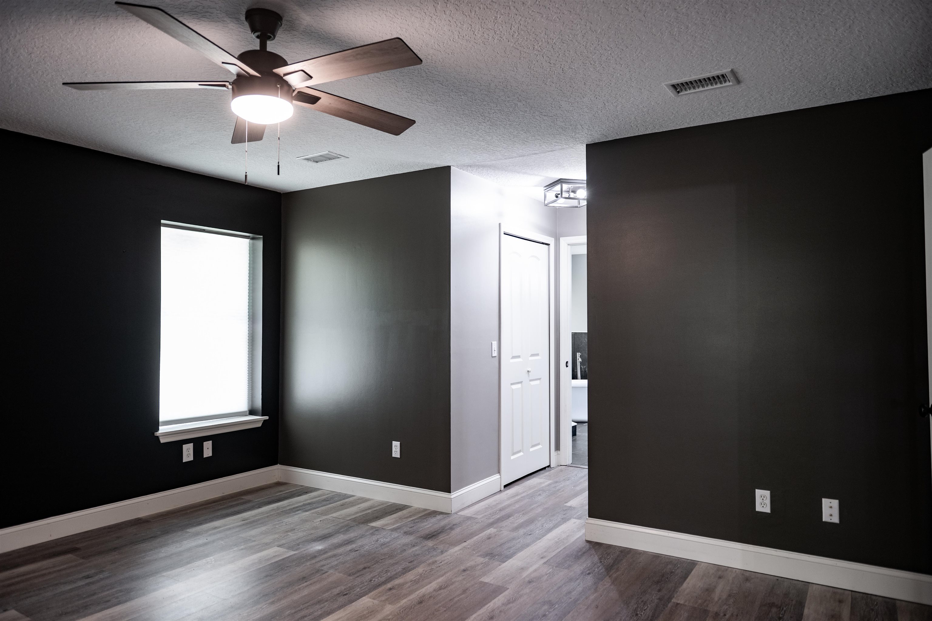 2950 Kings Road St. Augustine, FL 32086 - Photo 24 of 42 an empty room with windows and fan