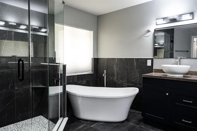 a bed sitting in a bedroom chandelier