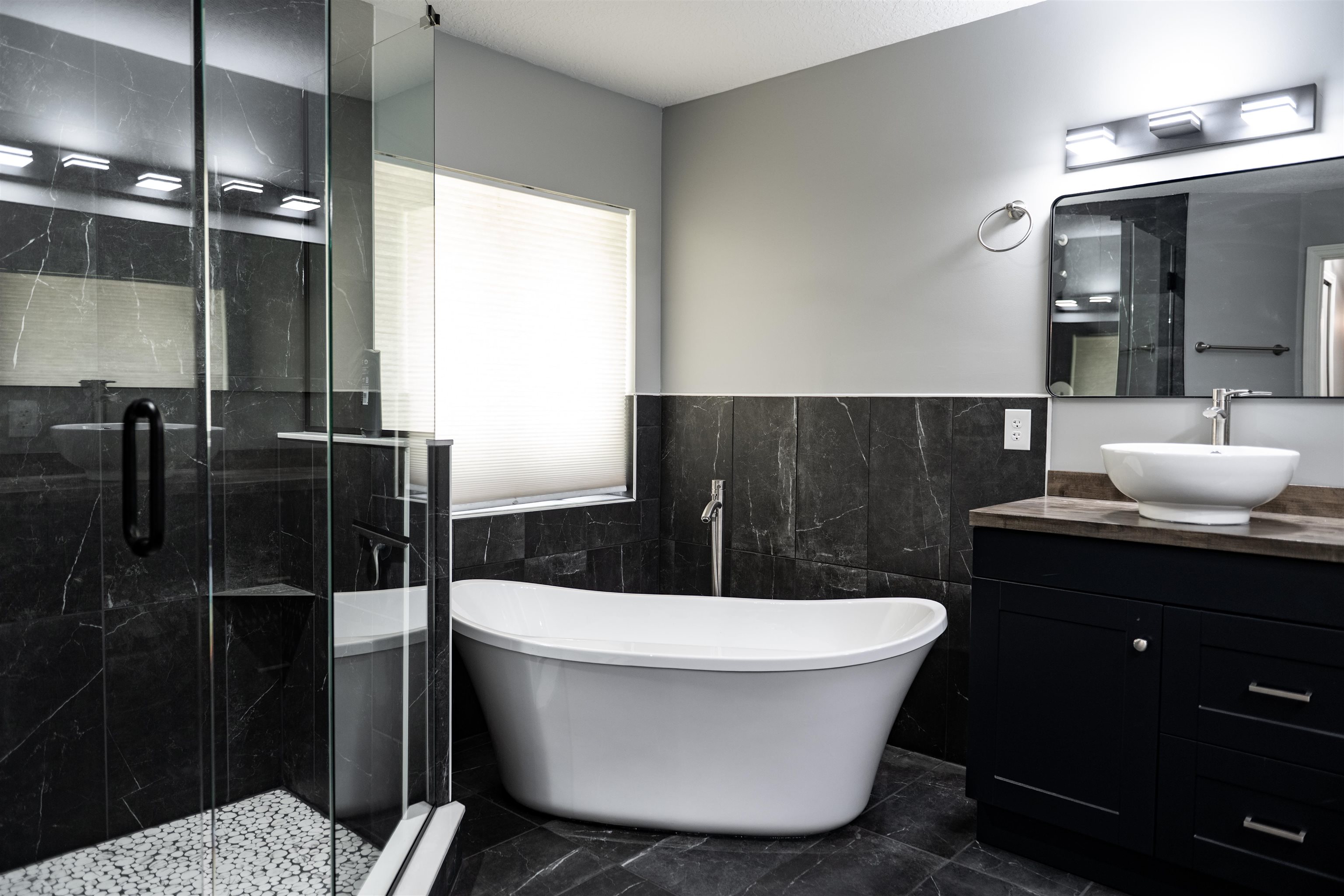 2950 Kings Road St. Augustine, FL 32086 - Photo 27 of 42 a bathroom with a bathtub and shower