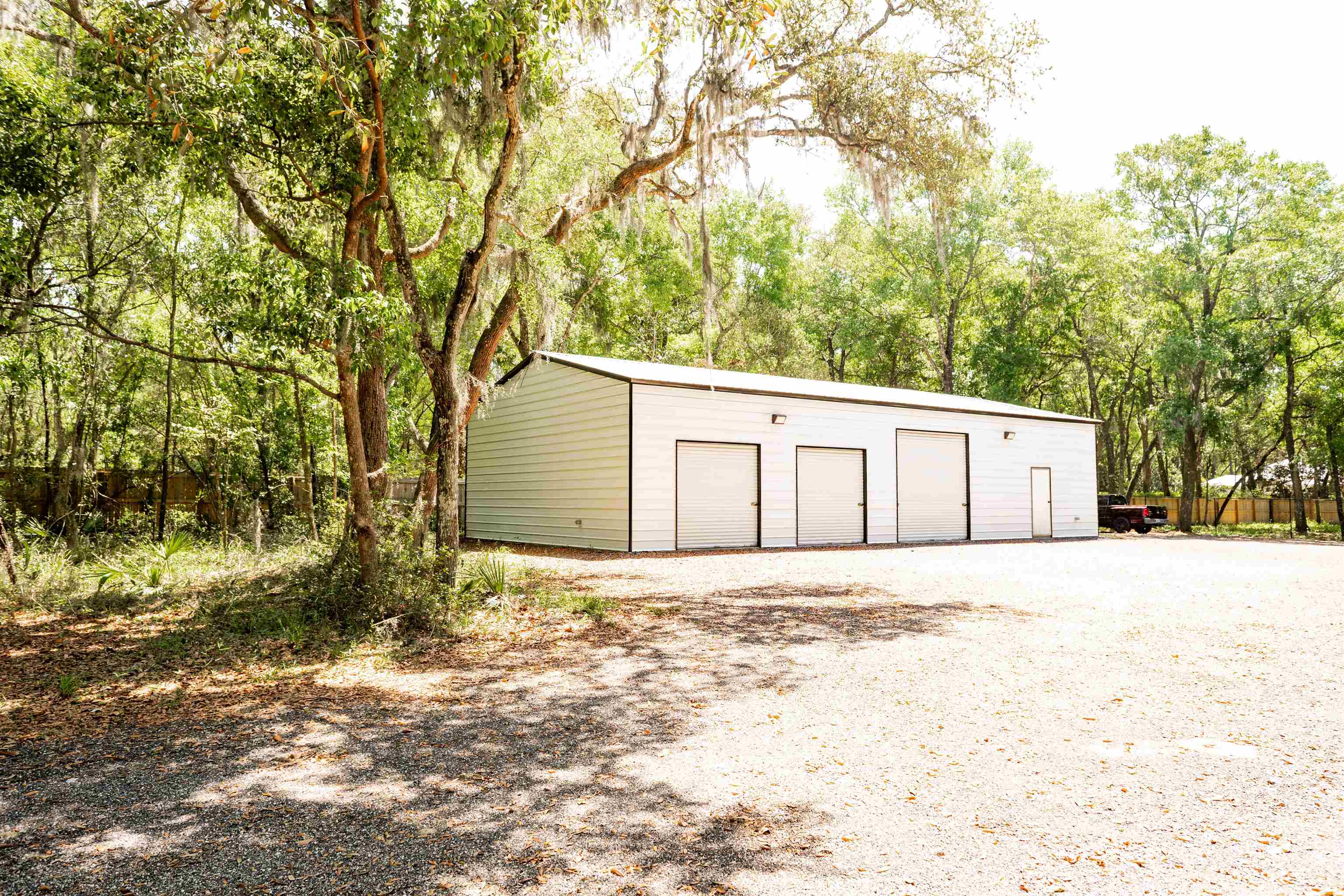 2950 Kings Road St. Augustine, FL 32086 - Photo 3 of 42 a white house that has tree in front of it