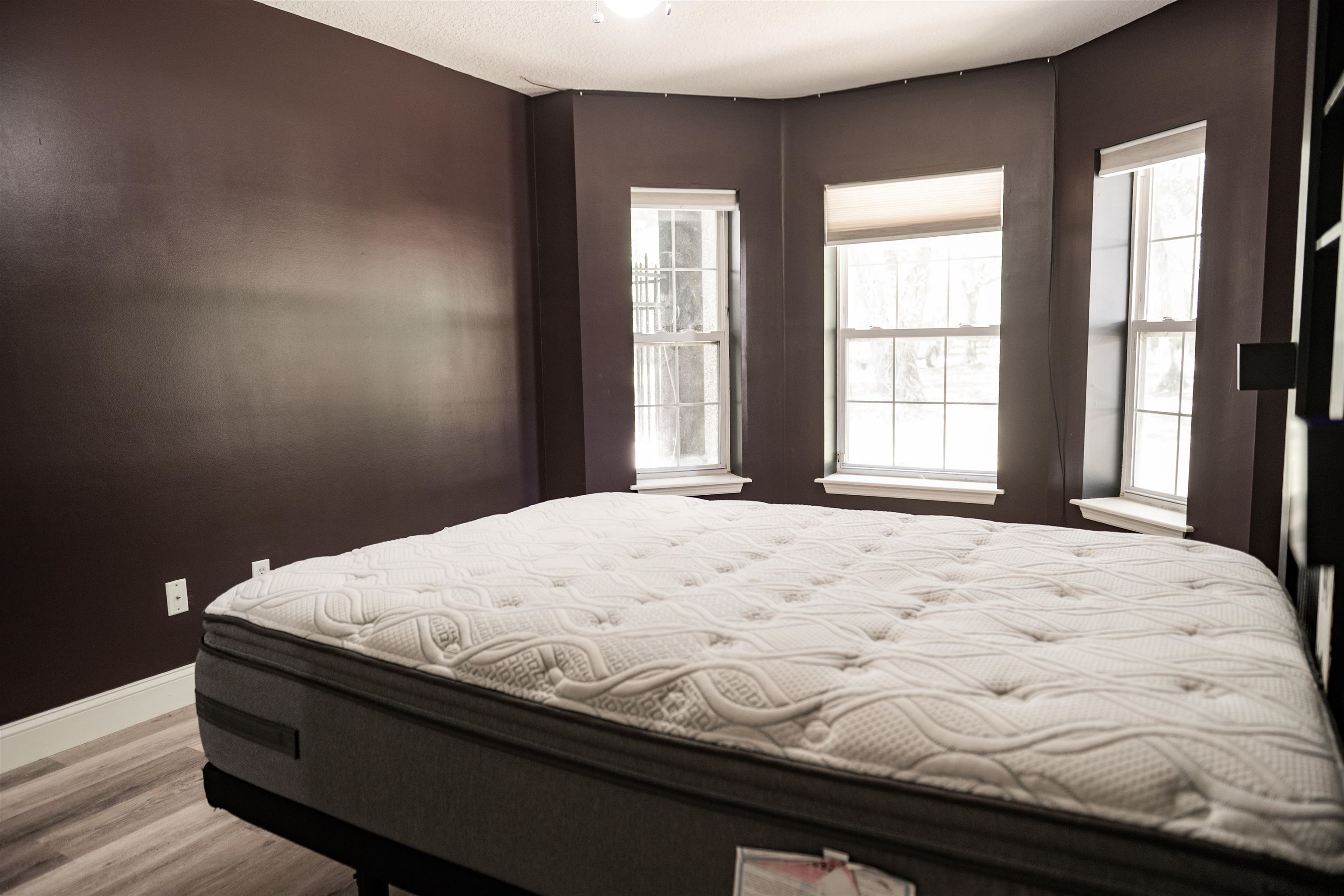 2950 Kings Road St. Augustine, FL 32086 - Photo 33 of 42 a bed sitting in a bedroom next to a window