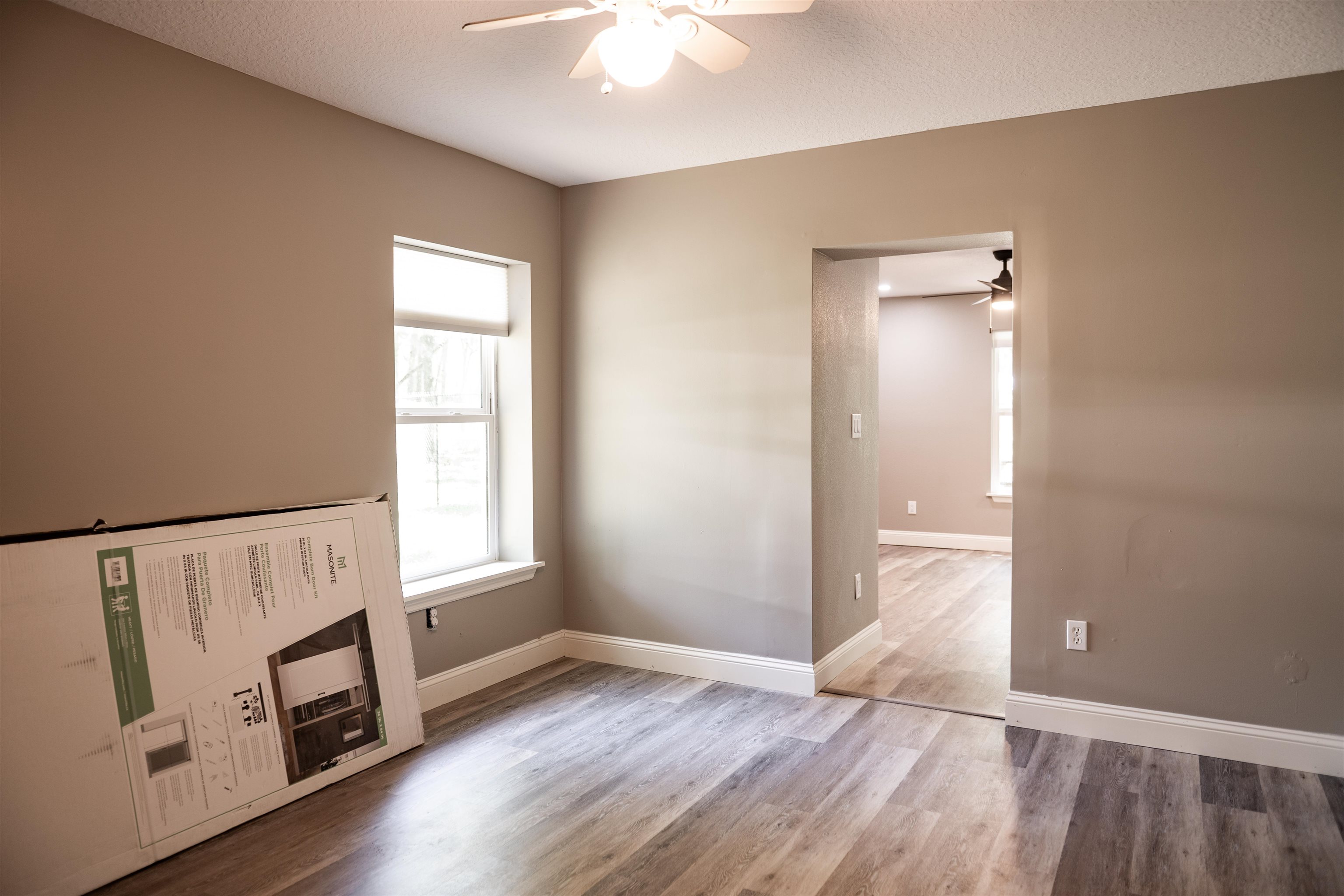 2950 Kings Road St. Augustine, FL 32086 - Photo 36 of 42 an empty room with wooden floor fan and windows