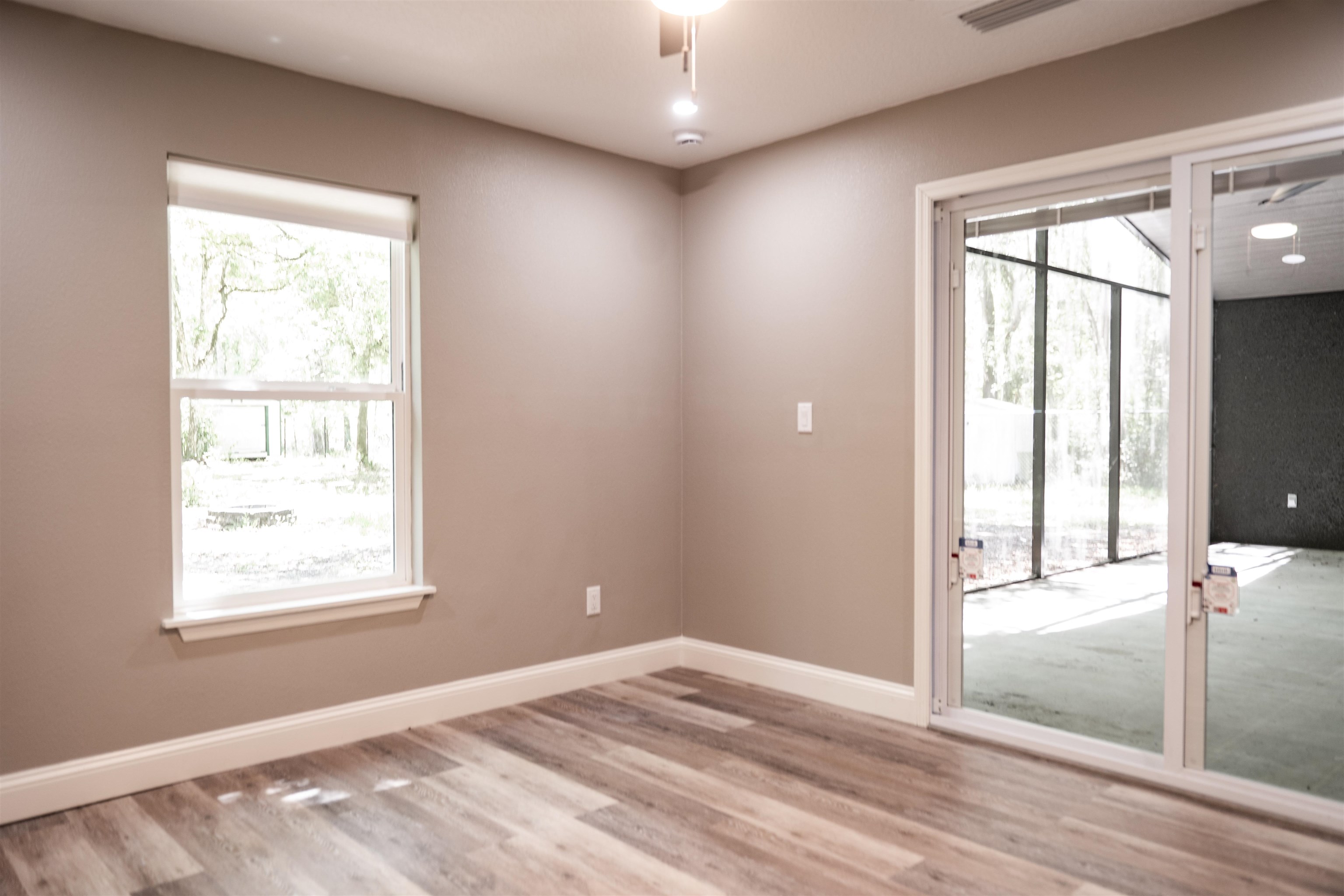 2950 Kings Road St. Augustine, FL 32086 - Photo 39 of 42 an empty room with wooden floor and windows