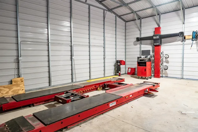 a view of backyard with swimming pool and trees