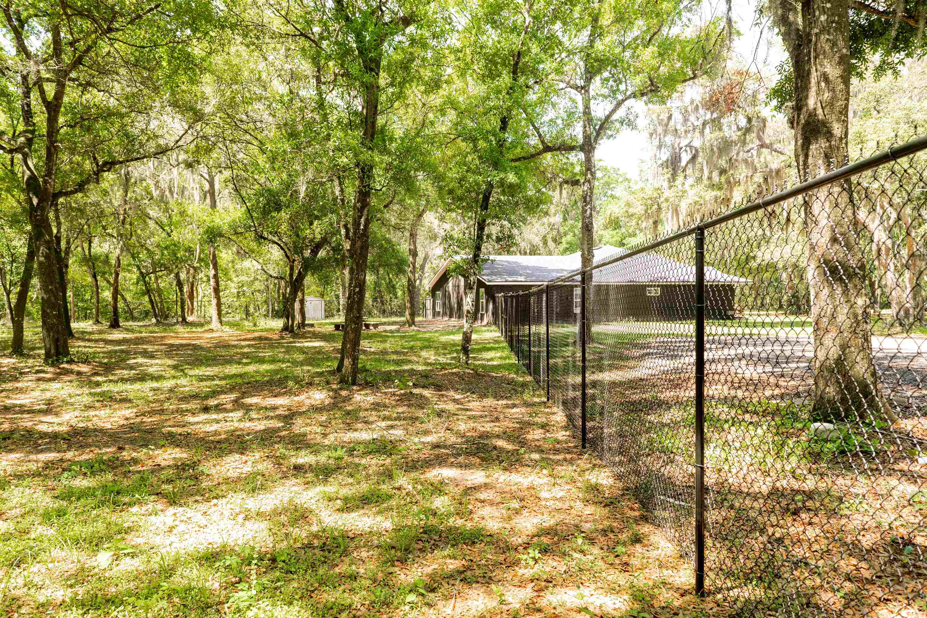 2950 Kings Road St. Augustine, FL 32086 - Photo 9 of 42 a backyard of a house with table and chairs