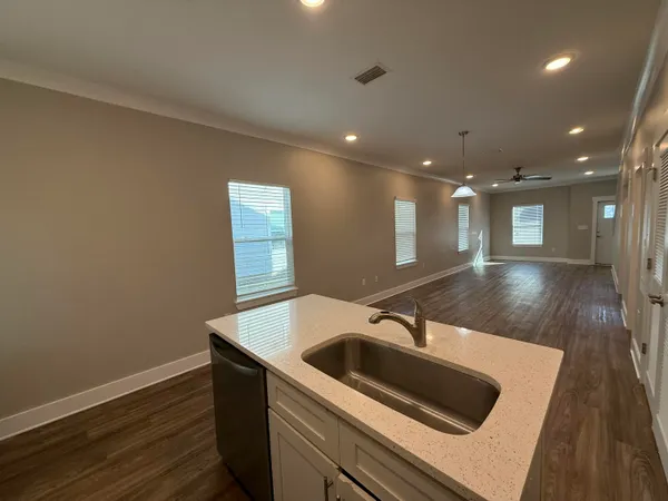 a kitchen with a sink and a refrigerator