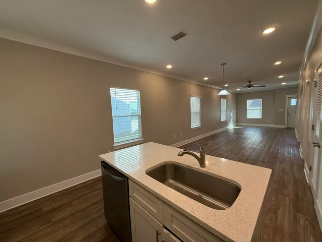 a kitchen with a sink and a refrigerator