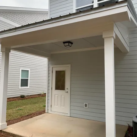 a view of a house with a door and a window