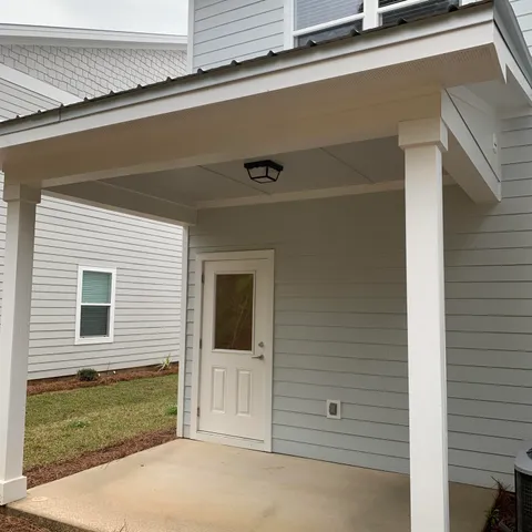 a view of a house with a door and a window