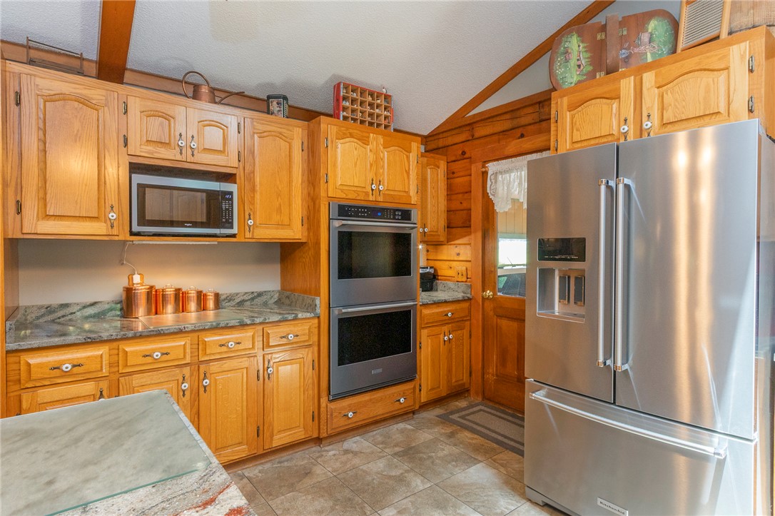 911 State Rd S-4-203 Belton, SC 29627 - Photo 12 of 49 A chef's delight, this kitchen showcases ample cabinetry, stainless steel appliances, and elegant stone countertops.