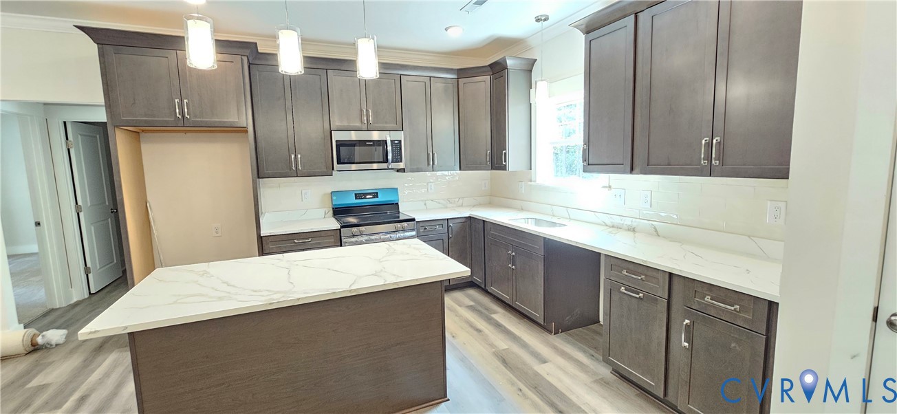 2982 Ashdale Road Center Cross, VA 22437 - Photo 11 of 17 Kitchen featuring an island with a quartz countert