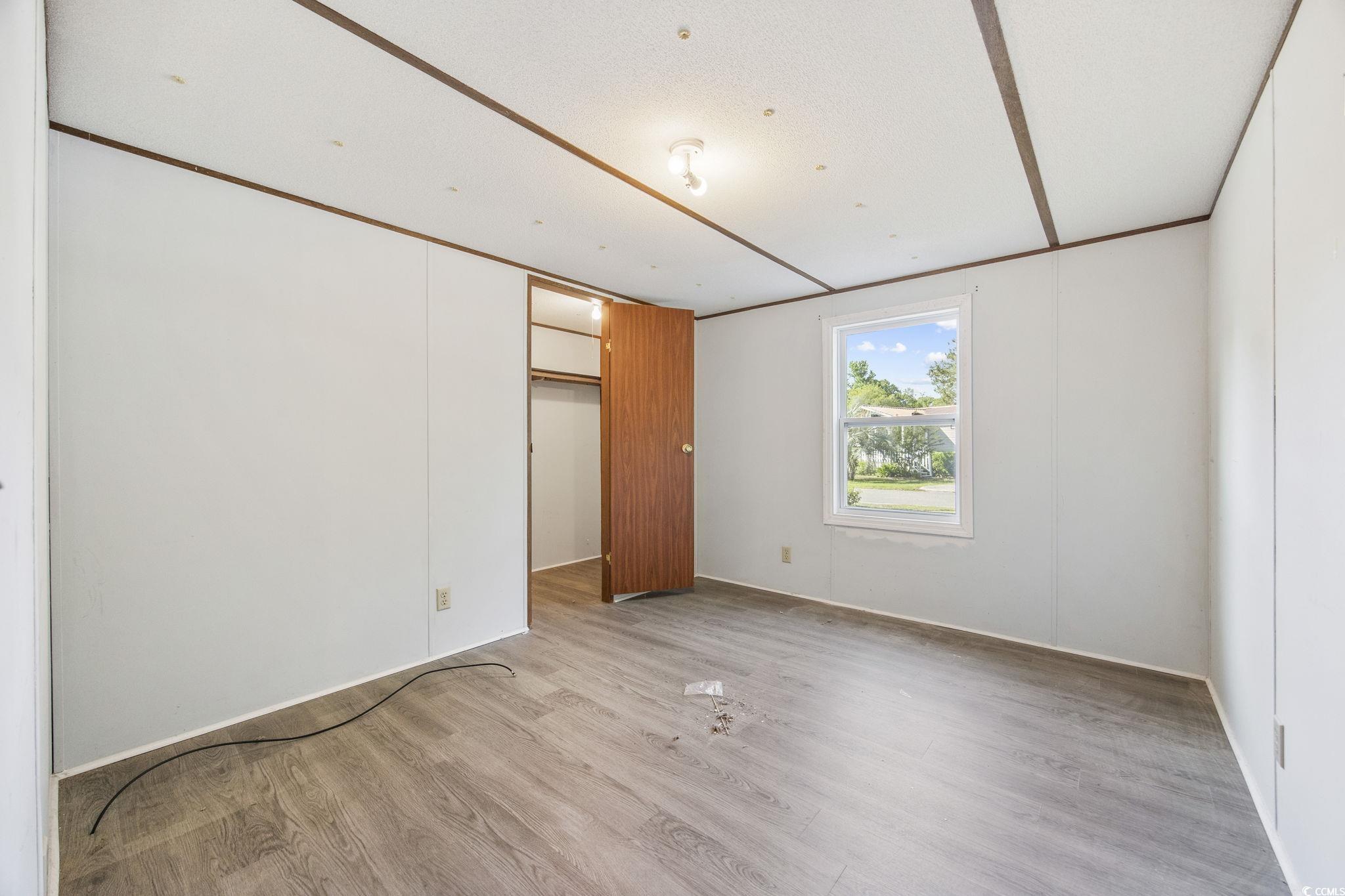 167 Offshore Drive Murrells Inlet, SC 29576 - Photo 15 of 33 Unfurnished bedroom with light wood-type flooring