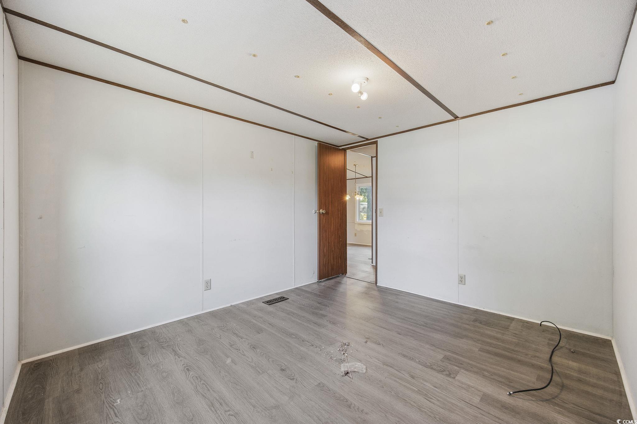 167 Offshore Drive Murrells Inlet, SC 29576 - Photo 16 of 33 Unfurnished room featuring wood finished floors