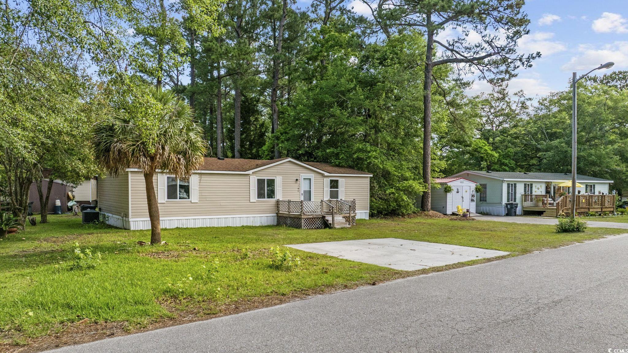 167 Offshore Drive Murrells Inlet, SC 29576 - Photo 2 of 33 Manufactured / mobile home featuring a front lawn