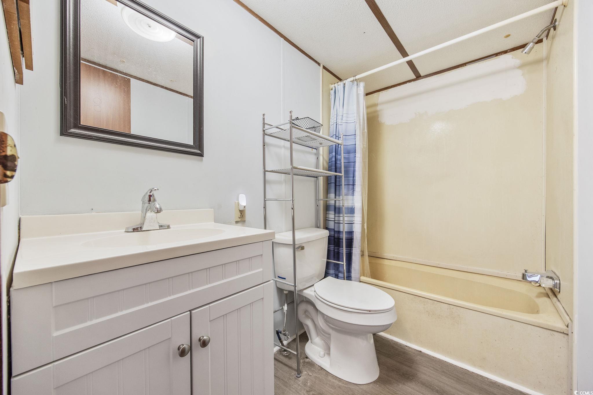 167 Offshore Drive Murrells Inlet, SC 29576 - Photo 21 of 33 Bathroom featuring wood finished floors, vanity, t