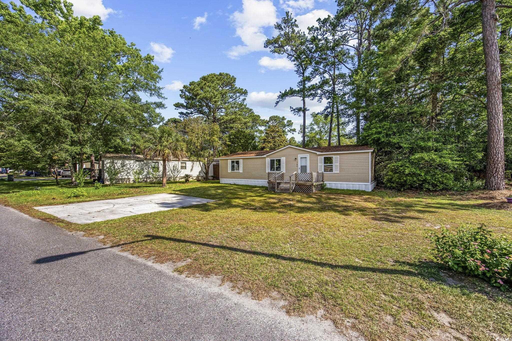 167 Offshore Drive Murrells Inlet, SC 29576 - Photo 28 of 33 Manufactured / mobile home featuring a front yard