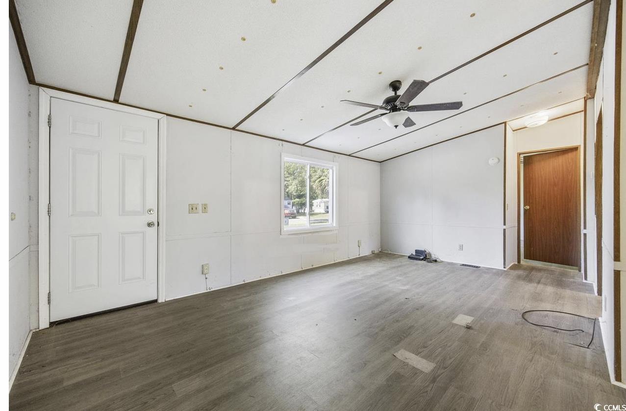 167 Offshore Drive Murrells Inlet, SC 29576 - Photo 3 of 33 Unfurnished living room with wood finished floors,