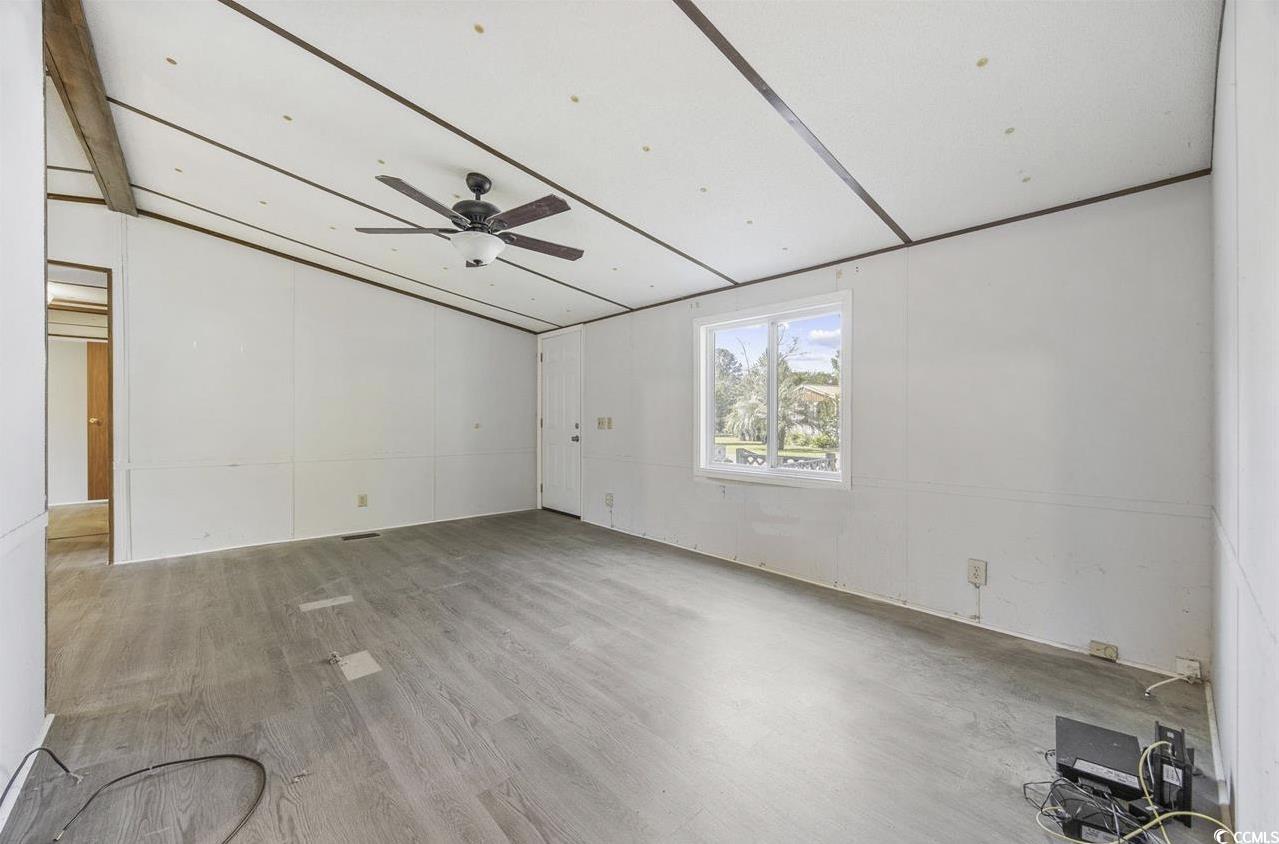 167 Offshore Drive Murrells Inlet, SC 29576 - Photo 6 of 33 Spare room with ceiling fan and wood finished floo