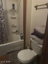 12342 Madison Road Huntsburg, OH 44046 - Photo 8 of 21 Bathroom featuring shower / bath combo with shower curtain and toilet