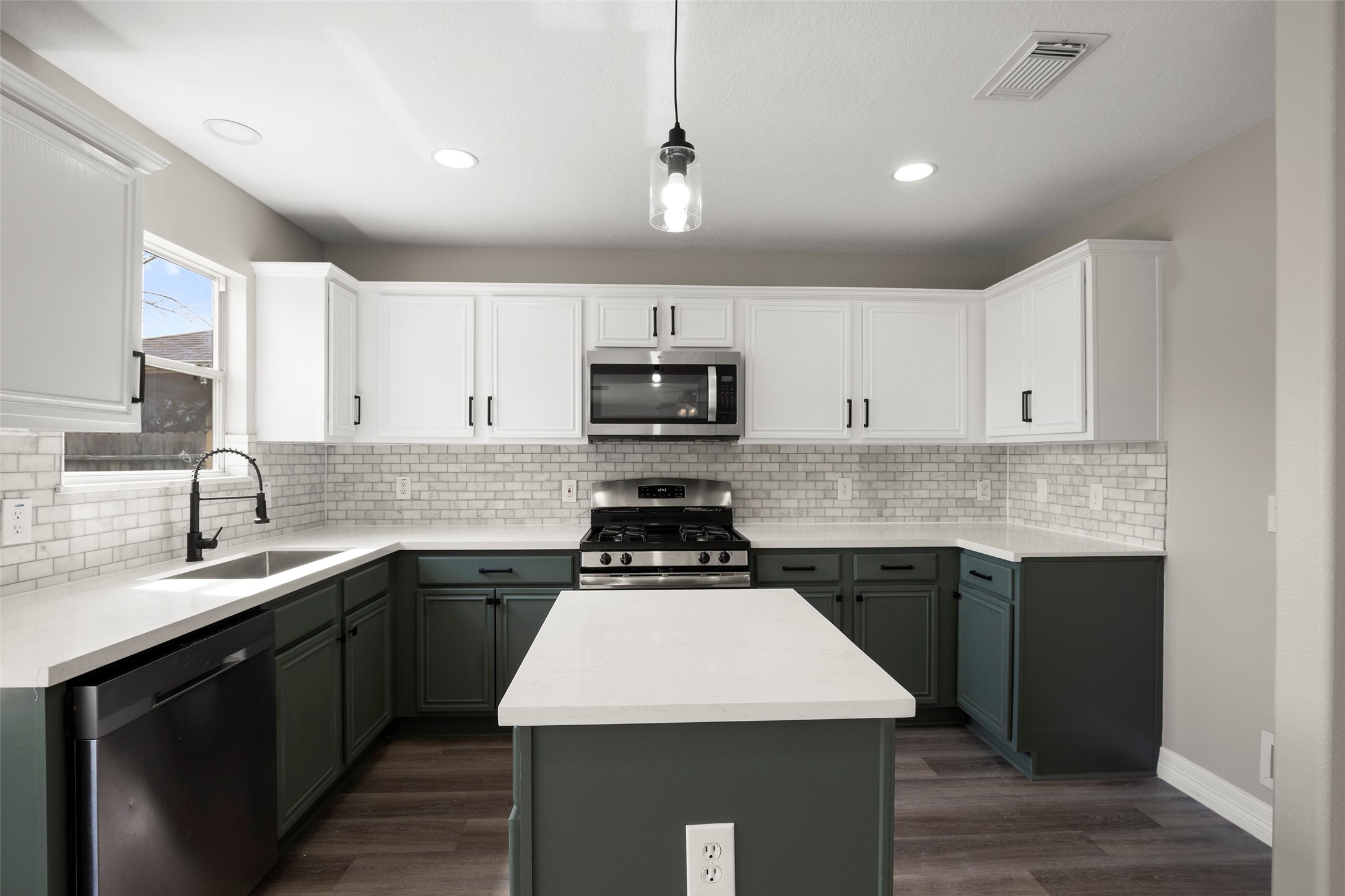 2406 Pinpoint Drive Spring, TX 77373 - Photo 14 of 25 a kitchen with a sink stove and microwave