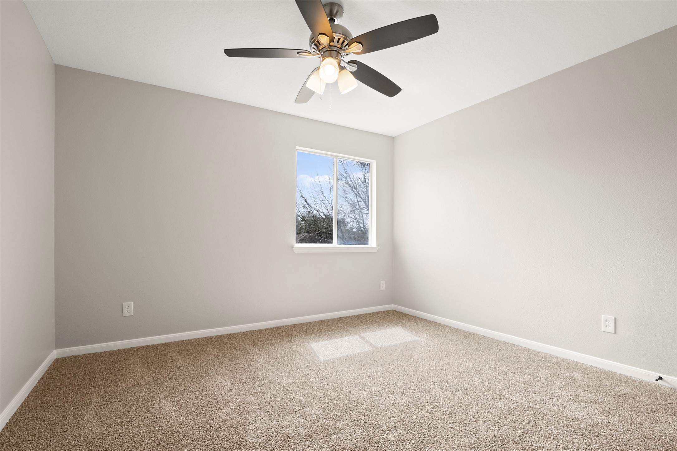 2406 Pinpoint Drive Spring, TX 77373 - Photo 20 of 25 an empty room with a window and a fan