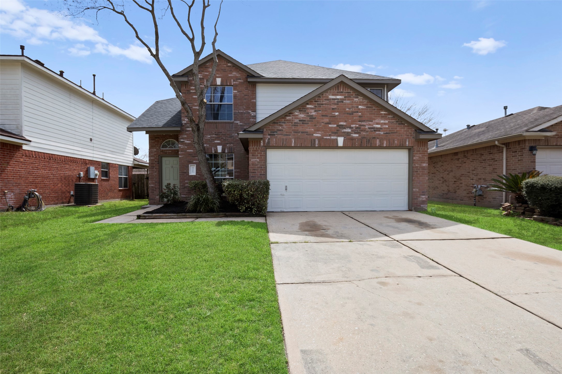 2406 Pinpoint Drive Spring, TX 77373 - Photo 2 of 25 a front view of a house with garden