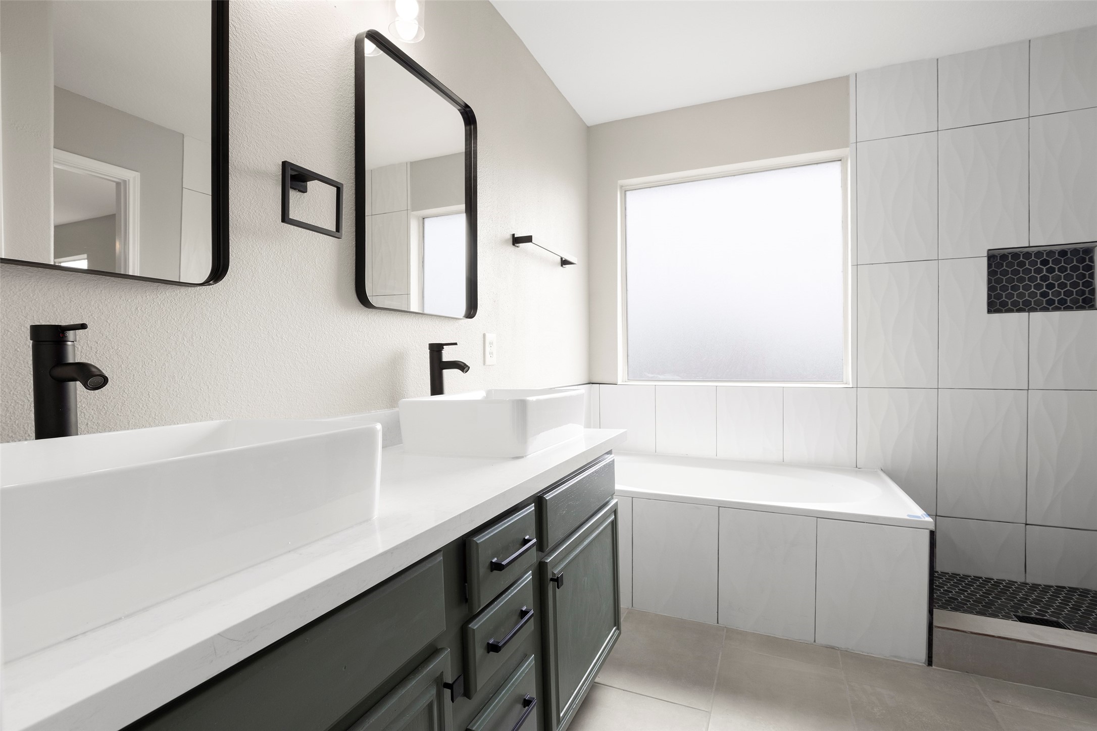 2406 Pinpoint Drive Spring, TX 77373 - Photo 22 of 25 a bathroom with a sink and a bathtub