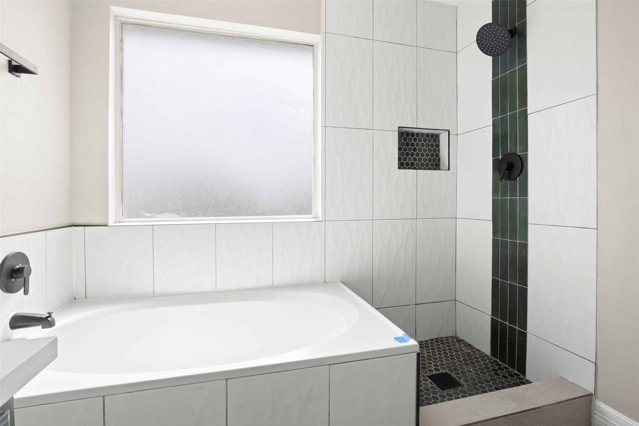 2406 Pinpoint Drive Spring, TX 77373 - Photo 23 of 25 a bathroom with a bathtub and a shower