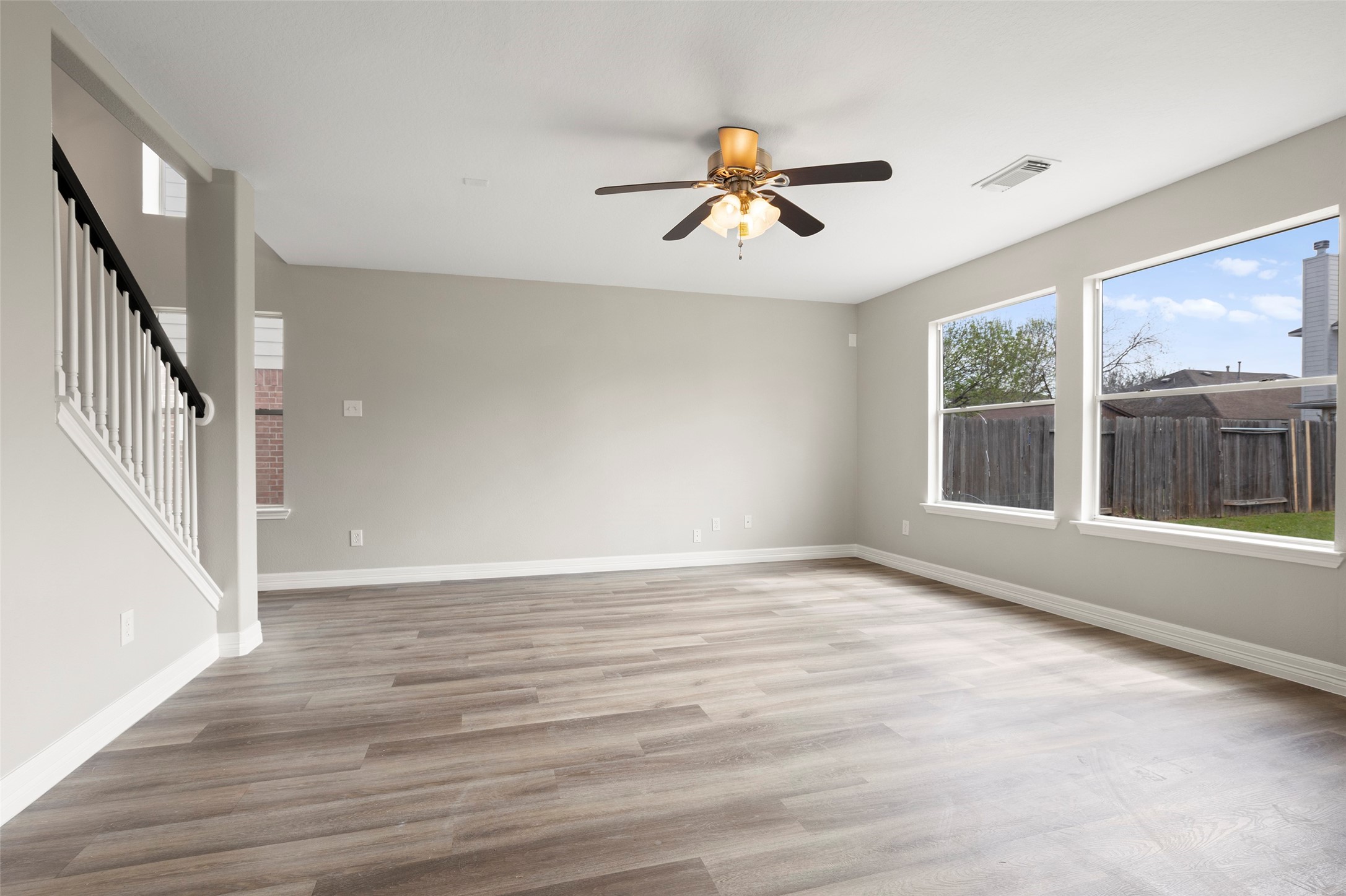 2406 Pinpoint Drive Spring, TX 77373 - Photo 6 of 25 a view of an empty room with wooden floor and a window