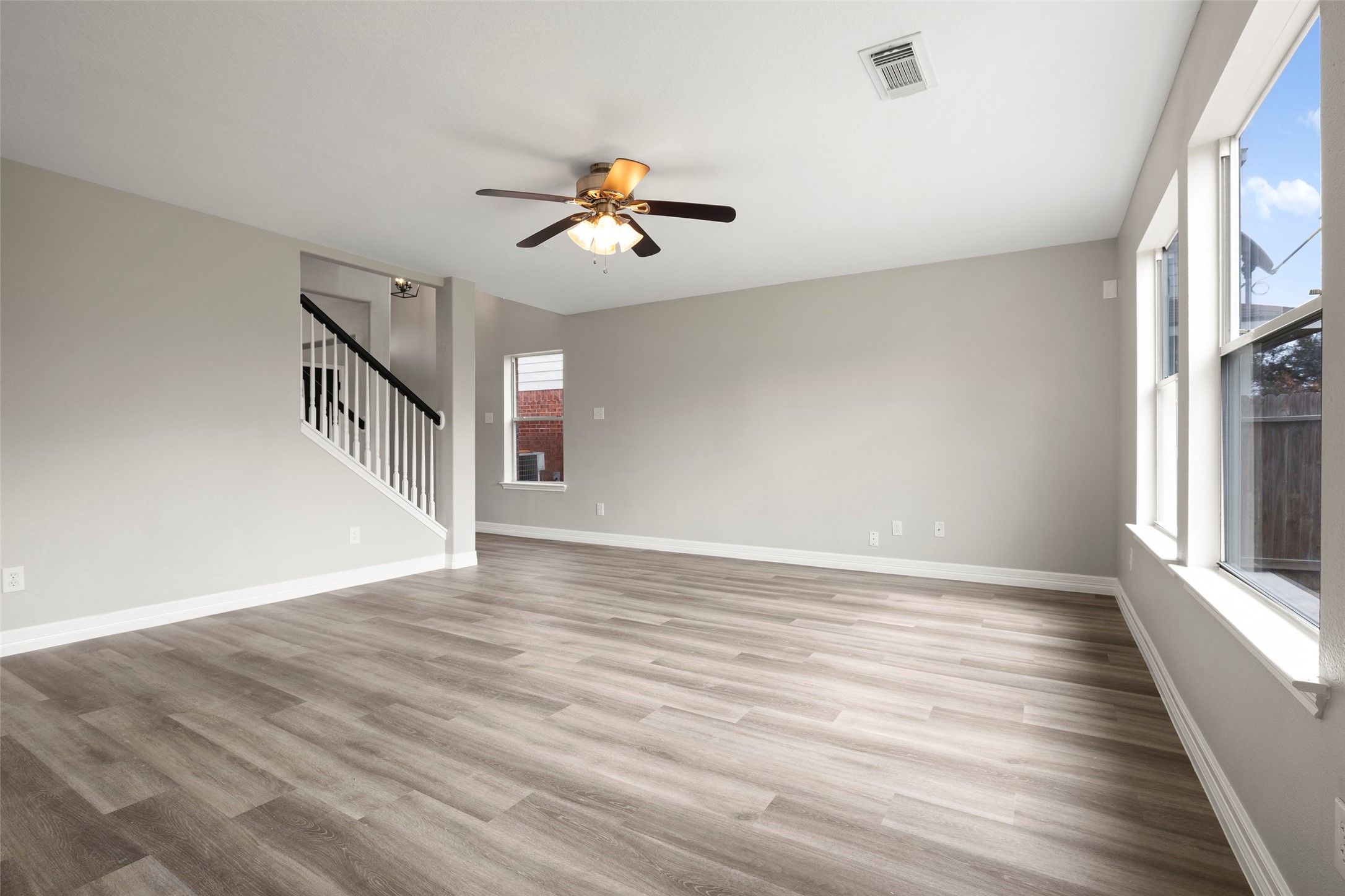 2406 Pinpoint Drive Spring, TX 77373 - Photo 7 of 25 a view of an empty room with wooden floor and a window