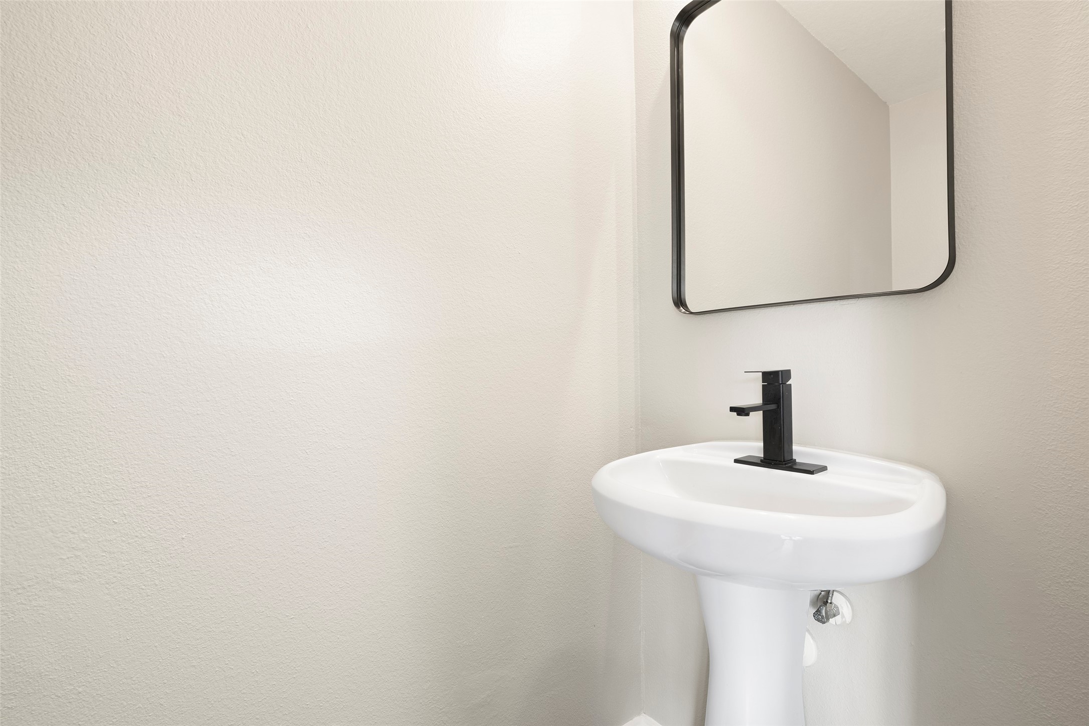 2406 Pinpoint Drive Spring, TX 77373 - Photo 10 of 25 a bathroom with a sink and a mirror
