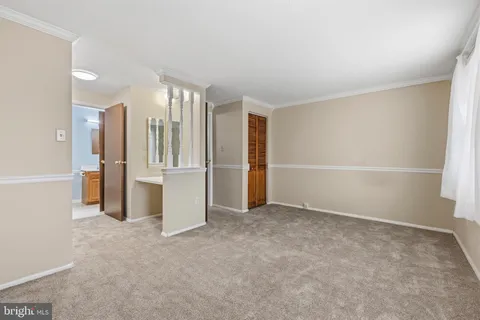 a bathroom with a bathtub and a toilet