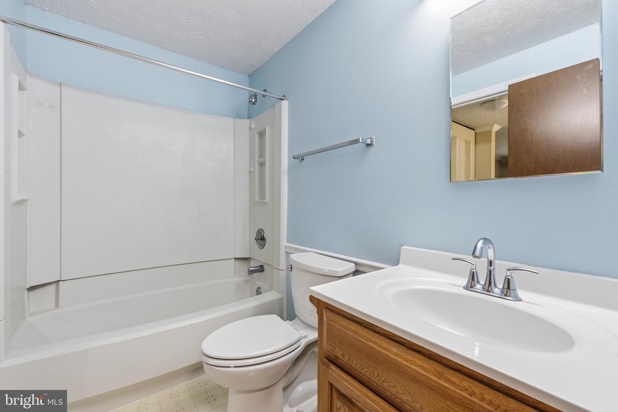 232 Canfield Terrace Frederick, MD 21702 - Photo 14 of 30 a bathroom with a sink toilet and shower
