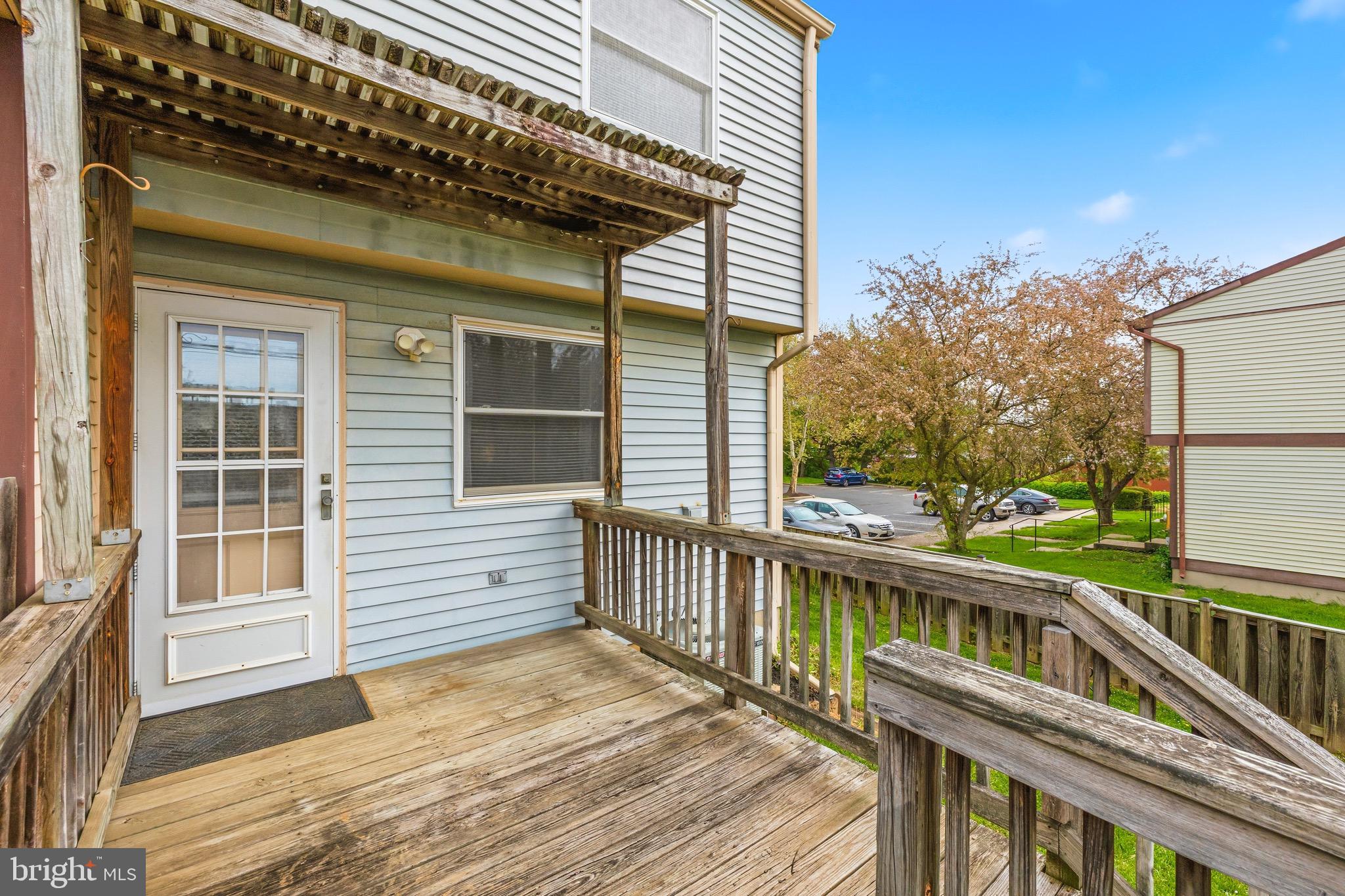 232 Canfield Terrace Frederick, MD 21702 - Photo 25 of 30 a view of a house with a wooden deck