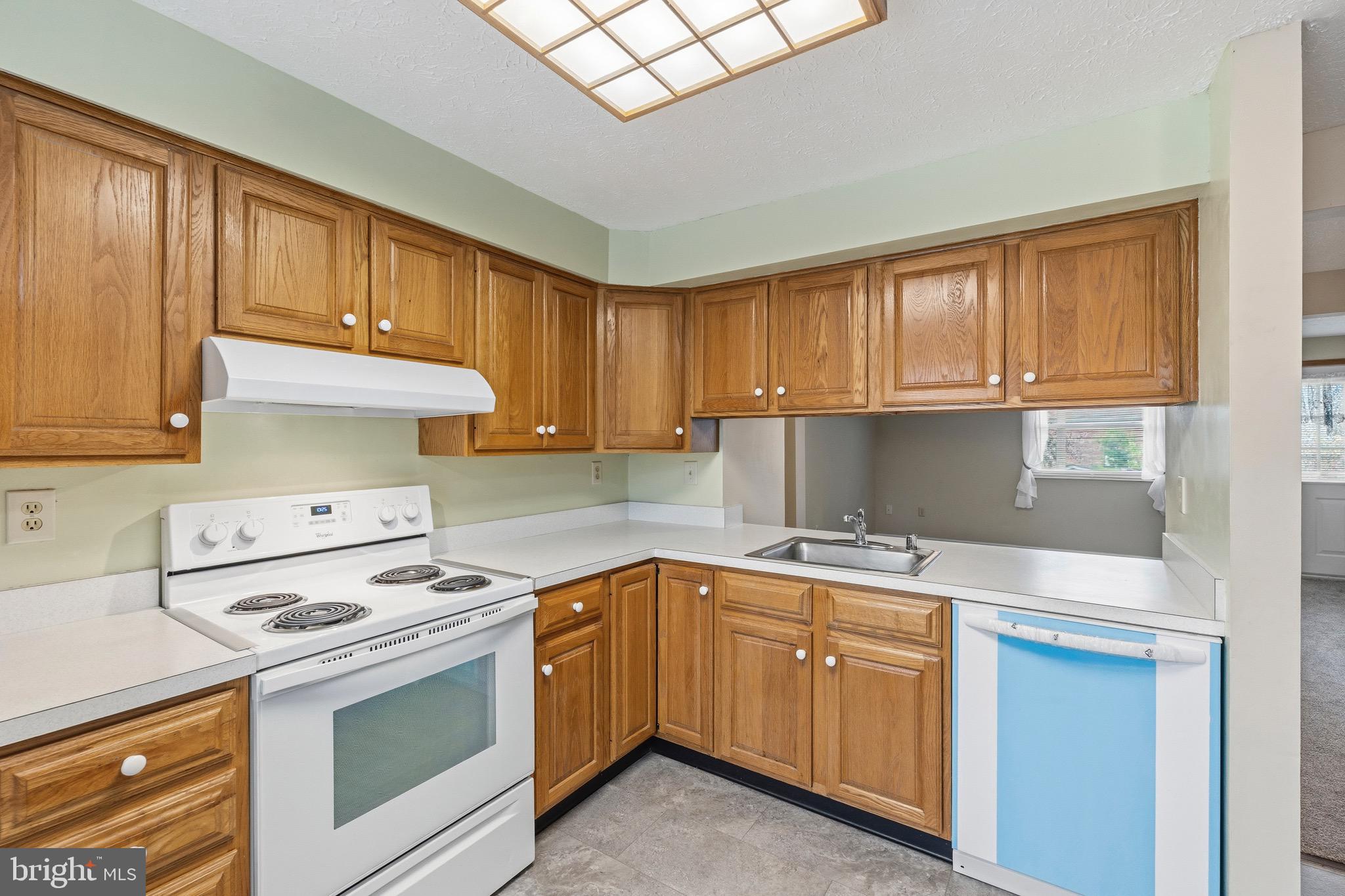232 Canfield Terrace Frederick, MD 21702 - Photo 3 of 30 a kitchen with a sink stove and cabinets