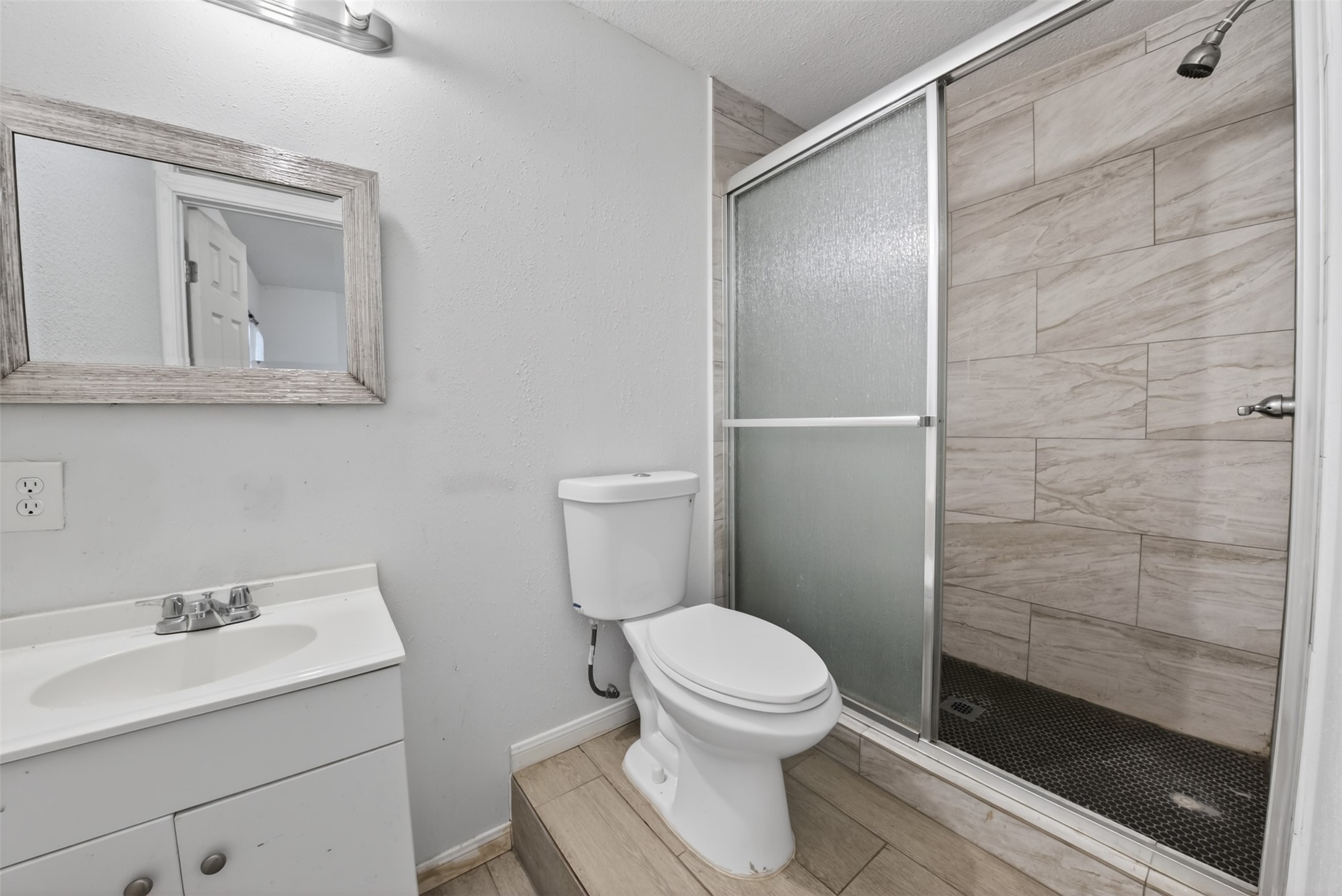 8029 Tareyton Lane Houston, TX 77075 - Photo 10 of 20 a bathroom with a sink a toilet and shower