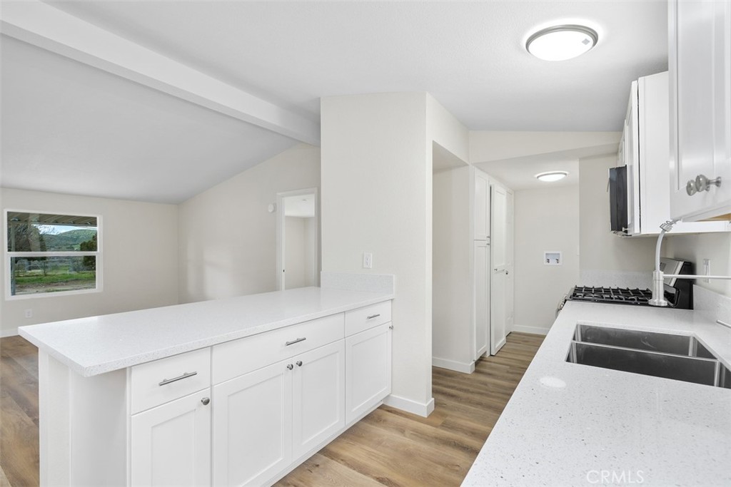 42580 East Benton Road Hemet, CA 92544 - Photo 15 of 31 a kitchen with white cabinets and sink