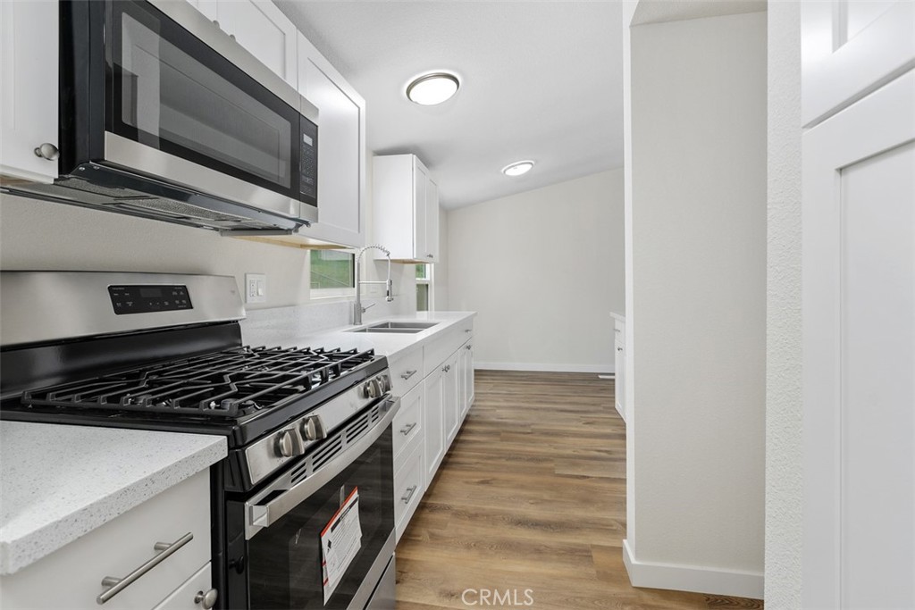 42580 East Benton Road Hemet, CA 92544 - Photo 17 of 31 a kitchen with stainless steel appliances a stove and a microwave