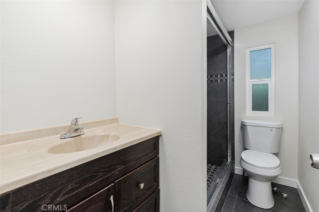 42580 East Benton Road Hemet, CA 92544 - Photo 20 of 31 a bathroom with a sink and a toilet