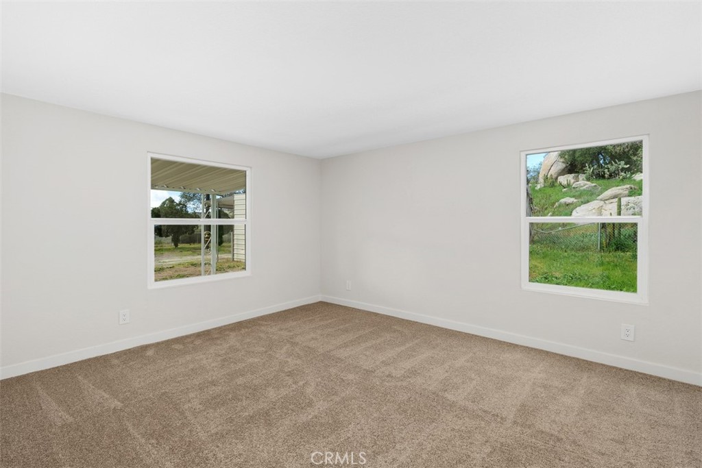 42580 East Benton Road Hemet, CA 92544 - Photo 21 of 31 an empty room with windows